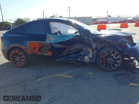 2022 Tesla Model Y Performance with VIN 7SAYGDEF5NF336693, listed as a IAAI auction lot 41805752 with 42,009 mi miles and . Bid and sale history available at DreamBid. Image 12.