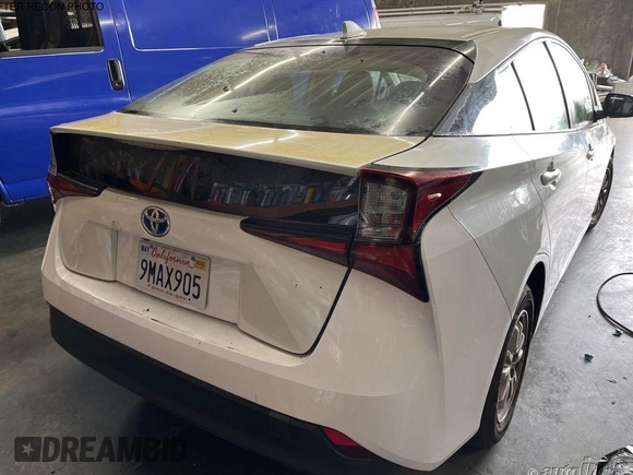 2019 Toyota Prius L Eco z VIN JTDKARFU1K3071925, wystawiony jako IAAI lot #42287457 z przebiegiem 99 671 mil mil oraz . Historia ofert i sprzedaży dostępna na DreamBid. Obrazek 1.