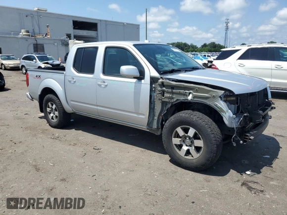 2010 Nissan Frontier Pro-4X with VIN 1N6AD0EV5AC435641, listed as a Copart auction lot 63388025 with 84,349 mi miles and Salvage title. Bid and sale history available at DreamBid. Image 4.
