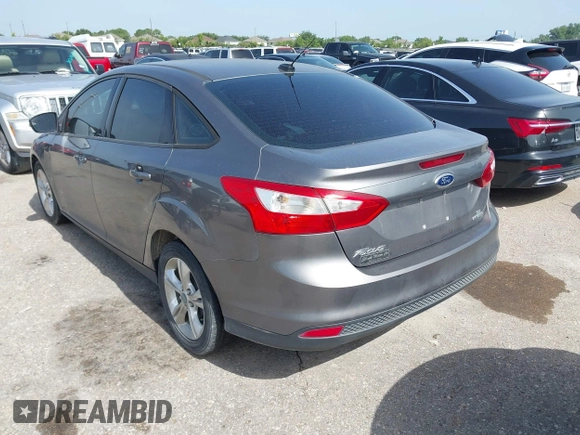 2013 Ford Focus SE with VIN 1FADP3F23DL131327, listed as a IAAI auction lot 42577474 with 146,412 mi miles and . Bid and sale history available at DreamBid. Image 3.