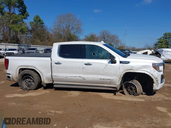 2020 GMC Sierra 1500 Denali z VIN 1GTU9FEL7LZ152659, wystawiony jako IAAI lot #41662492 z przebiegiem 101 222 mil mil oraz . Historia ofert i sprzedaży dostępna na DreamBid. Obrazek 13.