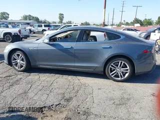 2014 Tesla Model S 60 with VIN 5YJSA1S11EFP35998, listed as a IAAI auction lot 42316563 with 83,835 mi miles and . Bid and sale history available at DreamBid. Image 15.