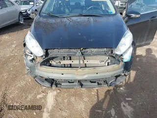 2014 Ford Fiesta Titanium z VIN 3FADP4FJXEM127644, wystawiony jako IAAI lot #41555040 z przebiegiem 107 046 mil mil oraz . Historia ofert i sprzedaży dostępna na DreamBid. Obrazek 6.