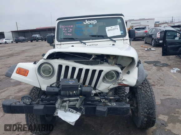2005 Jeep Wrangler Sport with VIN 1J4FA49S25P320240, listed as a IAAI auction lot 41433371 with 144,552 mi miles. Bid and sale history available at carsss.com. Image 12.
