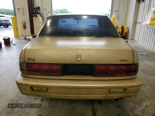 1993 Buick Regal Custom with VIN 2G4WB54L4P1411904, listed as a Copart auction lot 56564455 with 112,248 mi miles and Salvage title. Bid and sale history available at DreamBid. Image 6.