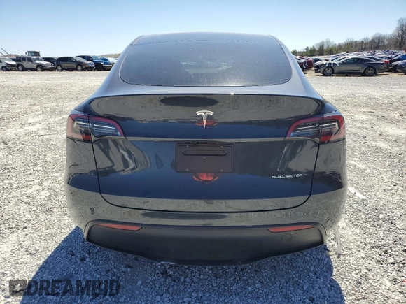 2025 Tesla Model Y Long Range with VIN 7SAYGAEEXSF253326, listed as a Copart auction lot 49527965 with 5,803 mi miles and Salvage Title. Bid and sale history available at DreamBid. Image 6.