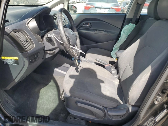 2013 Kia Rio EX with VIN KNADN4A30D6104166, listed as a Copart auction lot 56752345 with 129,708 mi miles and Salvage title. Bid and sale history available at DreamBid. Image 7.