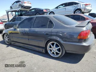 1998 Honda Civic LX with VIN 2HGEJ6673WH515915, listed as a Copart auction lot 52403795 with 224,174 mi miles and Salvage Title. Bid and sale history available at DreamBid. Image 2.