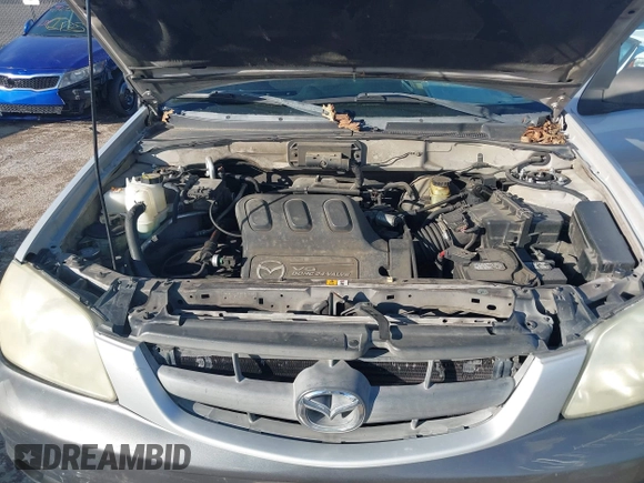 2003 Mazda Tribute LX with VIN 4F2YZ04183KM44733, listed as a IAAI auction lot 41472662 with 246,522 mi miles and . Bid and sale history available at DreamBid. Image 10.