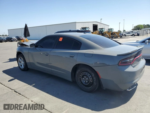 2019 Dodge Charger SXT with VIN 2C3CDXBGXKH659890, listed as a Copart auction lot 58011735 with 112,293 mi miles and Salvage title. Bid and sale history available at DreamBid. Image 2.