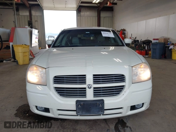 2006 Dodge Magnum z VIN 2D8GZ57286H100782, wystawiony jako IAAI lot #41816780 z przebiegiem 203 839 mil mil oraz . Historia ofert i sprzedaży dostępna na DreamBid. Obrazek 12.