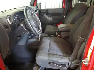 2012 Jeep Wrangler Unlimited Sport z VIN 1C4BJWDG2CL171531, wystawiony jako Copart lot #62181805 z przebiegiem 195 394 mil mil oraz Szkoda całkowita • Salvage title. Historia ofert i sprzedaży dostępna na DreamBid. Obrazek 7.