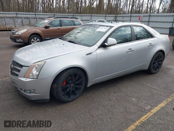 2009 Cadillac CTS AWD z VIN 1G6DH577X90135559, wystawiony jako IAAI lot #42077850 z przebiegiem 175 345 mil mil oraz . Historia ofert i sprzedaży dostępna na DreamBid. Obrazek 2.