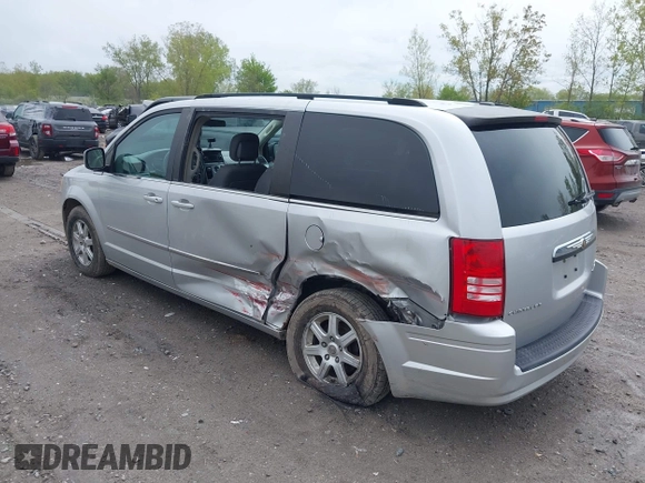 2010 Chrysler Town & Country Touring with VIN 2A4RR5D14AR271397, listed as a IAAI auction lot 42181231 with 200,547 mi miles and . Bid and sale history available at DreamBid. Image 3.