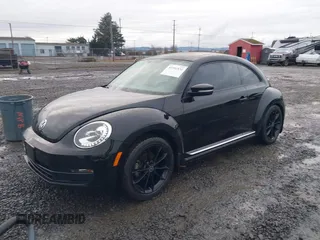2014 Volkswagen Beetle 2.5L w/Sun with VIN 3VWJP7AT3EM608906, listed as a IAAI auction lot 41501830 with 42,804 mi miles and . Bid and sale history available at DreamBid. Image 2.
