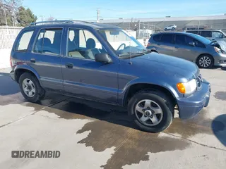 2001 Kia Sportage with VIN KNDJB723015065059, listed as a IAAI auction lot 41554856 with 170,827 mi miles. Bid and sale history available at carsss.com. Image 1.