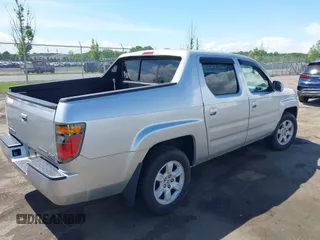 2007 Honda Ridgeline RTL z VIN 2HJYK16527H521549, wystawiony jako IAAI lot #42192558 z przebiegiem 227 162 mil mil oraz . Historia ofert i sprzedaży dostępna na DreamBid. Obrazek 4.