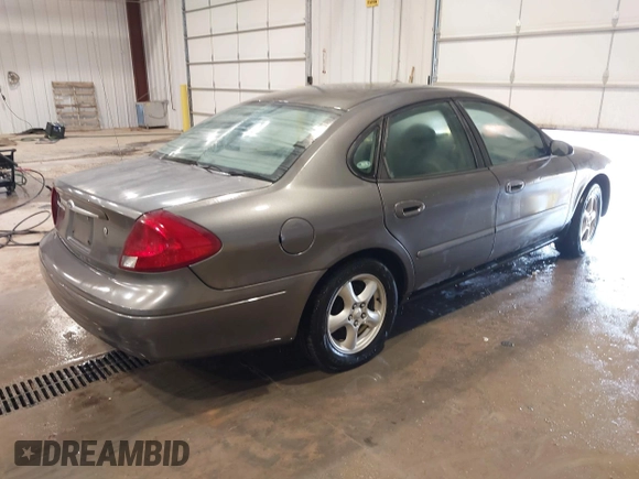 2003 Ford Taurus SE Standard z VIN 1FAFP53UX3G167579, wystawiony jako IAAI lot #42140606 z przebiegiem 178 147 mil mil oraz . Historia ofert i sprzedaży dostępna na DreamBid. Obrazek 4.