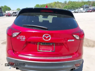 2015 Mazda CX-5 Grand Touring with VIN JM3KE4DY5F0469439, listed as a IAAI auction lot 42053851 with 70,676 mi miles. Bid and sale history available at carsss.com. Image 16.