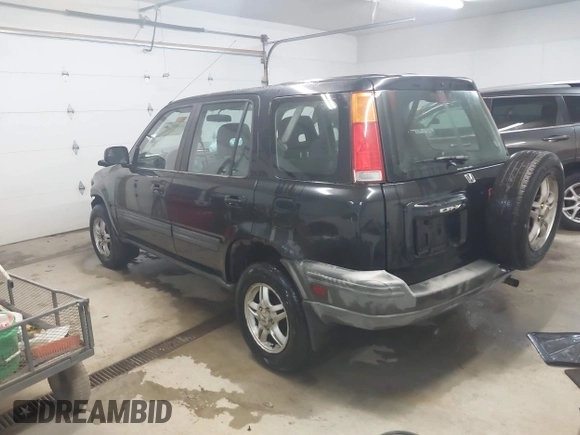 2000 Honda CR-V EX with VIN JHLRD1865YS007202, listed as a IAAI auction lot 41801108 with 134,387 mi miles. Bid and sale history available at carsss.com. Image 3.