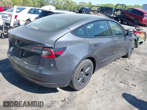 2023 Tesla Model 3 with VIN 5YJ3E1EA6PF645110, listed as a IAAI auction lot 42044357 with 24,352 mi miles and . Bid and sale history available at DreamBid. Image 4.