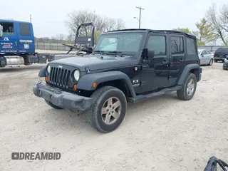 2007 Jeep Wrangler Unlimited X with VIN 1J4GA39177L153387, listed as a IAAI auction lot 42021211 with 207,965 mi miles and . Bid and sale history available at DreamBid. Image 17.