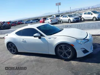 2015 Scion FR-S with VIN JF1ZNAA12F9709707, listed as a IAAI auction lot 41545940 with 107,575 mi miles. Bid and sale history available at carsss.com. Image 13.