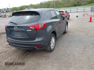 2014 Mazda CX-5 Touring with VIN JM3KE2CYXE0332517, listed as a IAAI auction lot 42109592 with 138,214 mi miles. Bid and sale history available at carsss.com. Image 4.