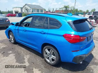 2021 BMW X1 xDrive28i with VIN WBXJG9C04M5T61811, listed as a IAAI auction lot 42509852 with 30,400 mi miles and . Bid and sale history available at DreamBid. Image 3.