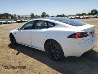 2017 Tesla Model S 100D с VIN 5YJSA1E27HF199003, выставлен на аукционе Copart как лот 59214775 с пробегом 99 673 миль миль и Списание • Salvage title. История ставок и продаж доступна на DreamBid. Изображение 2.