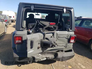 2023 Jeep Wrangler Sport with VIN 1C4HJXDN1PW701944, listed as a Copart auction lot 69973104 with 24,733 mi miles and Salvage Title. Bid and sale history available at DreamBid. Image 6.