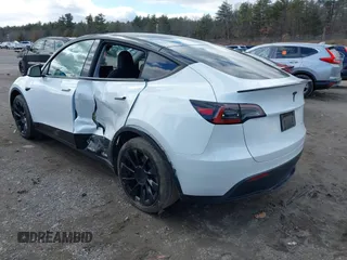 2023 Tesla Model Y Long Range with VIN 7SAYGDEE7PF832007, listed as a IAAI auction lot 41751598 with 14,126 mi miles and . Bid and sale history available at DreamBid. Image 3.