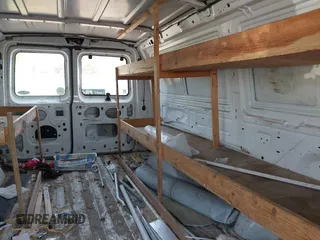 1999 Ford Econoline Cargo with VIN 1FTRE1420XHA34056, listed as a IAAI auction lot 41998411 with 236,267 mi miles. Bid and sale history available at carsss.com. Image 8.
