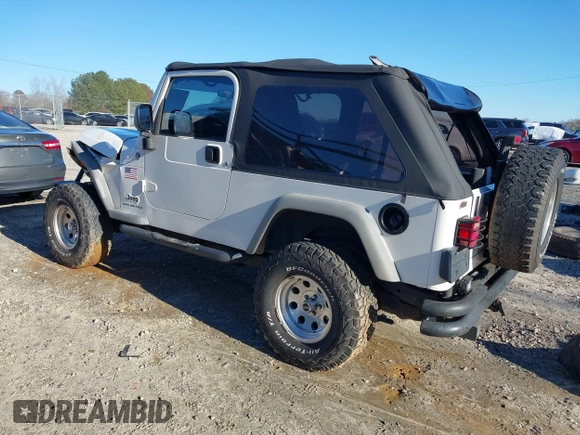 2005 Jeep Wrangler Unlimited with VIN 1J4FA44SX5P316055, listed as a IAAI auction lot 41586898 with 218,181 mi miles. Bid and sale history available at carsss.com. Image 3.