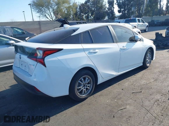 2021 Toyota Prius L Eco with VIN JTDKAMFU0M3149875, listed as a IAAI auction lot 41966010 with 99,542 mi miles. Bid and sale history available at carsss.com. Image 4.