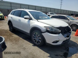 2015 Mazda CX-9 Grand Touring with VIN JM3TB3DA7F0454094, listed as a Copart auction lot 61757035 with 56,997 mi miles and Salvage title. Bid and sale history available at DreamBid. Image 4.