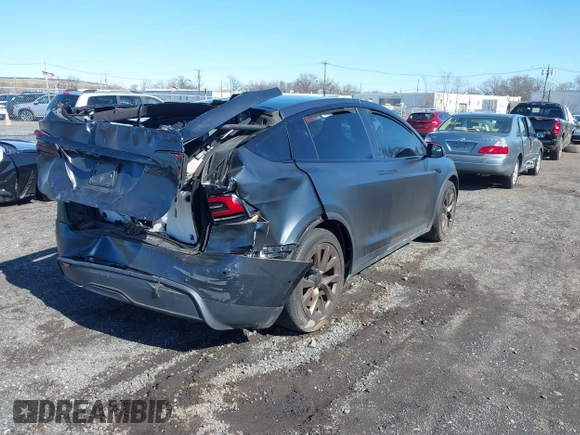 2022 Tesla Model X with VIN 7SAXCDE52NF345835, listed as a IAAI auction lot 41823522 with 24,401 mi miles and . Bid and sale history available at DreamBid. Image 4.