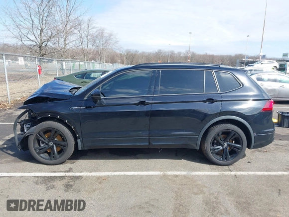 2023 Volkswagen Tiguan SE R-Line Black with VIN 3VVCB7AXXPM094621, listed as a IAAI auction lot 41737103 with 21,069 mi miles and . Bid and sale history available at DreamBid. Image 14.