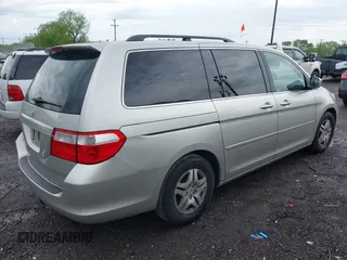 2007 Honda Odyssey EX-L with VIN 5FNRL38787B455417, listed as a IAAI auction lot 42104303 with 214,482 mi miles and . Bid and sale history available at DreamBid. Image 4.