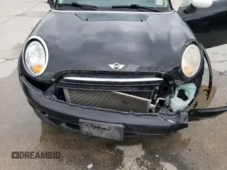 2011 MINI Hardtop z VIN WMWSU3C57BTX97044, wystawiony jako Copart lot #43625955 z przebiegiem 15 401 mil mil oraz Szkody całkowita. Historia ofert i sprzedaży dostępna na DreamBid. Obrazek 11.