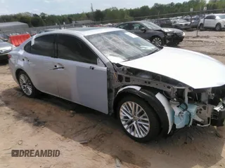 2014 Lexus ES 350 with VIN JTHBK1GG2E2111557, listed as a IAAI auction lot 42009244 with 116,469 mi miles. Bid and sale history available at carsss.com. Image 1.