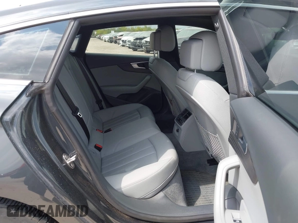2018 Audi A5 Sportback Premium z VIN WAUANCF5XJA022221, wystawiony jako IAAI lot #42041410 z przebiegiem 94 851 mil mil oraz . Historia ofert i sprzedaży dostępna na DreamBid. Obrazek 8.