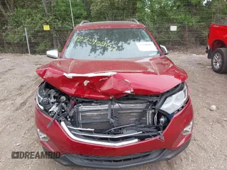 2018 Chevrolet Equinox Premier z VIN 2GNAXMEV3J6329268, wystawiony jako IAAI lot #42240907 z przebiegiem 61 487 mil mil oraz . Historia ofert i sprzedaży dostępna na DreamBid. Obrazek 12.