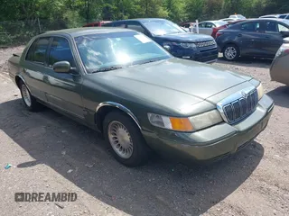 1999 Mercury Grand Marquis LS z VIN 2MEFM75W4XX677129, wystawiony jako IAAI lot #42113442 z przebiegiem 203 660 mil mil oraz . Historia ofert i sprzedaży dostępna na DreamBid. Obrazek 1.