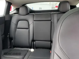 2024 Tesla Model Y с VIN 7SAYGDED1RF092027, выставлен на аукционе Copart как лот 51655485 с пробегом 22 010 миль миль и Списание • Salvage title. История ставок и продаж доступна на DreamBid. Изображение 10.