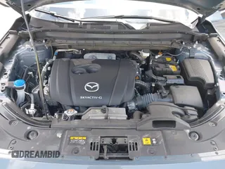 2024 Mazda CX-5 S Carbon Edition z VIN JM3KFBCLXR0521353, wystawiony jako IAAI lot #42351444 z przebiegiem 17 270 mil mil oraz . Historia ofert i sprzedaży dostępna na DreamBid. Obrazek 10.