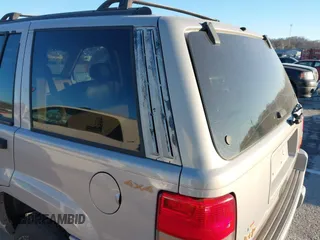 1997 Jeep Grand Cherokee Limited with VIN 1J4GZ78Y8VC718435, listed as a IAAI auction lot 41405361 with 210,599 mi miles. Bid and sale history available at carsss.com. Image 12.