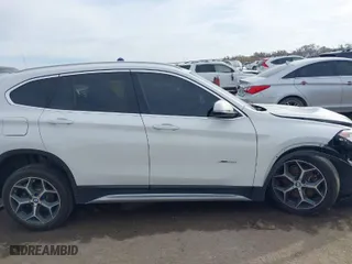 2018 BMW X1 xDrive28i with VIN WBXHT3C35J5K24695, listed as a IAAI auction lot 40932205 with 66,354 mi miles. Bid and sale history available at carsss.com. Image 12.