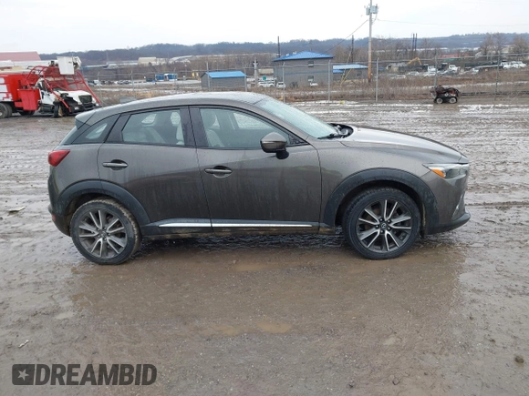 2016 Mazda CX-3 Grand Touring with VIN JM1DKBD77G0107328, listed as a IAAI auction lot 41682949 with 156,935 mi miles. Bid and sale history available at carsss.com. Image 13.