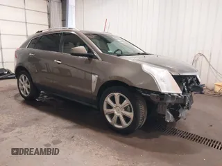 2014 Cadillac SRX Performance Collection z VIN 3GYFNFE38ES578066, wystawiony jako IAAI lot #42153023 z przebiegiem 134 009 mil mil oraz . Historia ofert i sprzedaży dostępna na DreamBid. Obrazek 1.